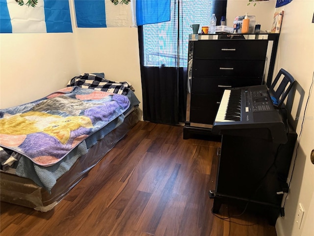 bedroom featuring dark hardwood / wood-style flooring