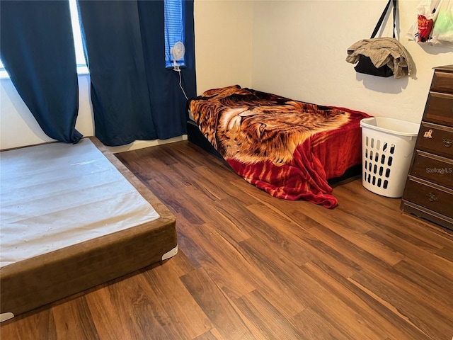 bedroom with hardwood / wood-style flooring