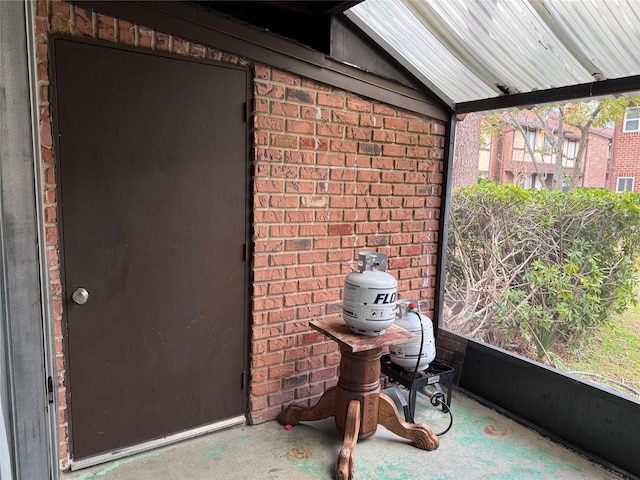 unfurnished sunroom featuring lofted ceiling