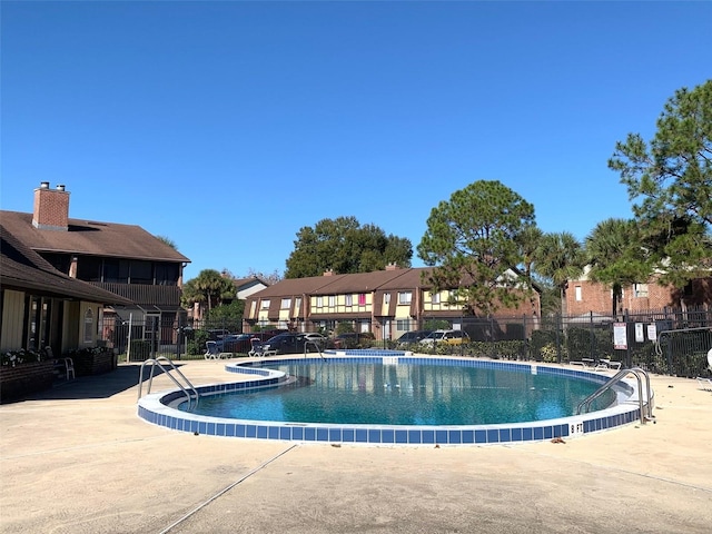 view of swimming pool featuring a patio area