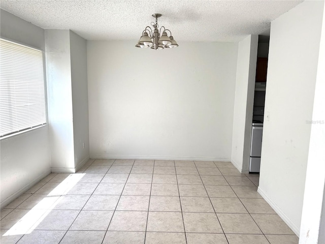 5123 Picadilly Circus Ct Unit 2, Orlando, FL 32839 - unfurnished room with a chandelier, a textured ceiling, and light tile patterned floors