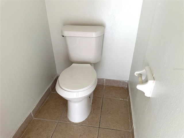 5123 Picadilly Circus Ct Unit 2, Orlando, FL 32839 - bathroom with toilet, tile patterned floors, and baseboards