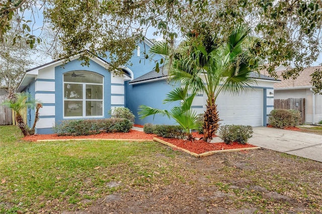 ranch-style home with a front yard and a garage