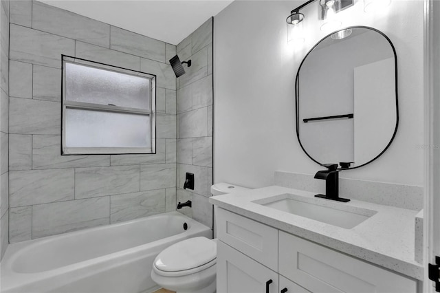 bathroom featuring toilet, bathtub / shower combination, and vanity