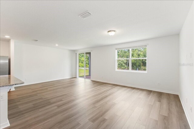 empty room with light wood-type flooring