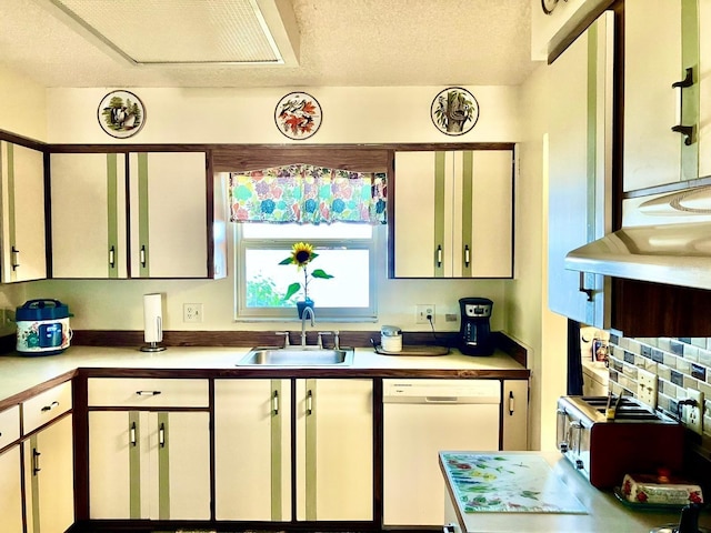 kitchen featuring white cabinetry, dishwasher, sink, and a textured ceiling