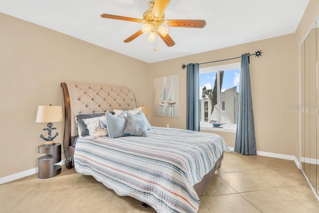 tiled bedroom with ceiling fan