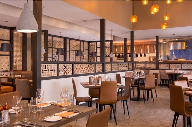 dining area featuring a high ceiling