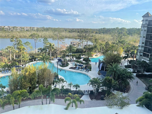 birds eye view of property with a water view