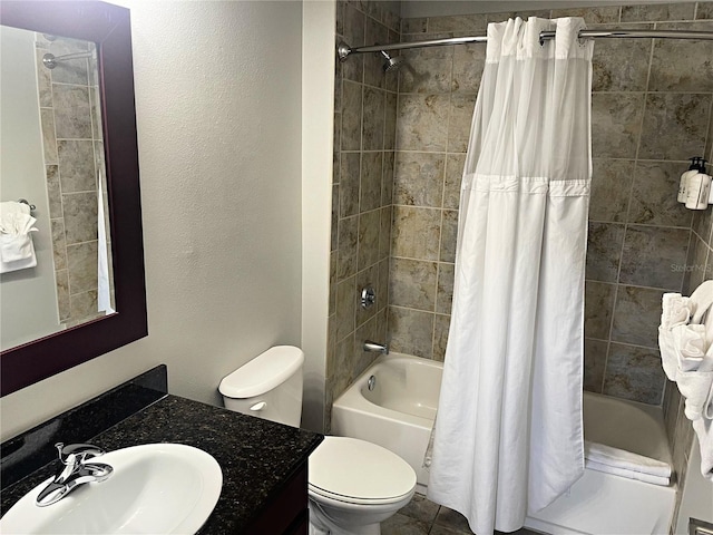 full bathroom featuring vanity, shower / tub combo with curtain, and toilet