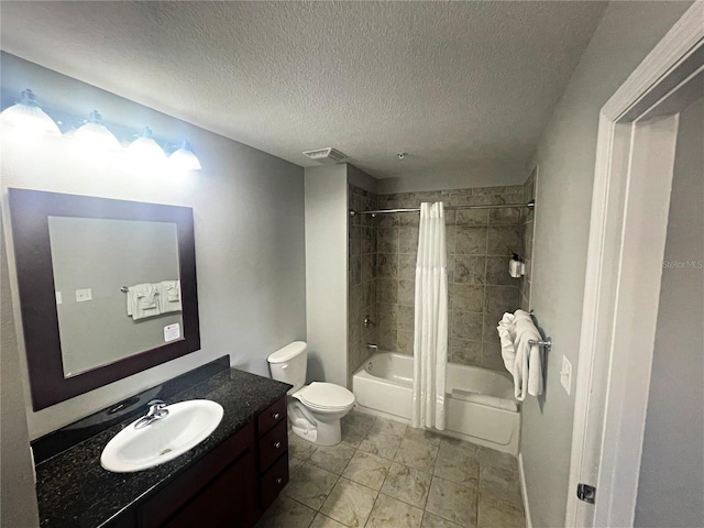 full bathroom with shower / tub combo with curtain, vanity, a textured ceiling, and toilet