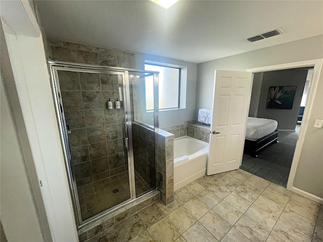 bathroom featuring independent shower and bath