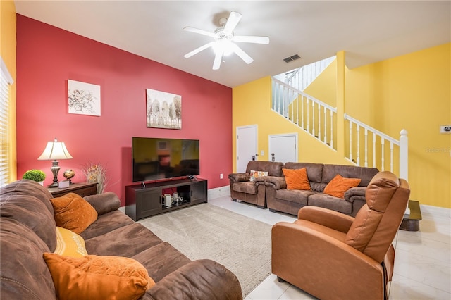 living room with ceiling fan and light tile patterned floors