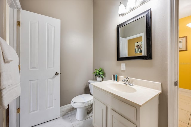 bathroom with toilet and vanity