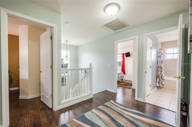 hallway with dark wood-type flooring