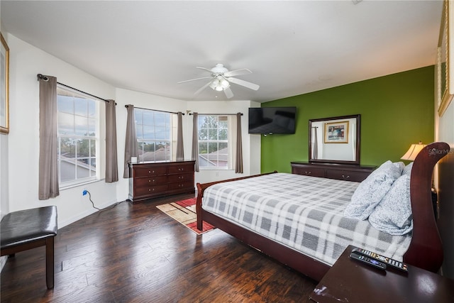 bedroom featuring dark wood-type flooring and ceiling fan