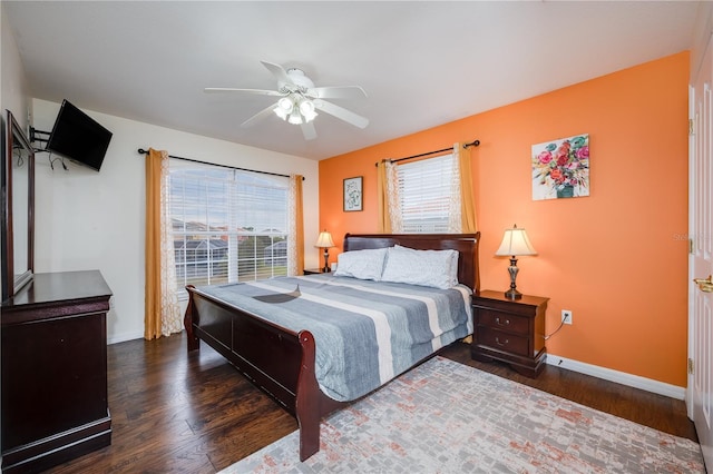 bedroom featuring ceiling fan and dark wood-type flooring