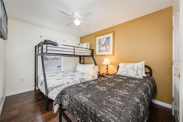 bedroom with ceiling fan and dark wood-type flooring