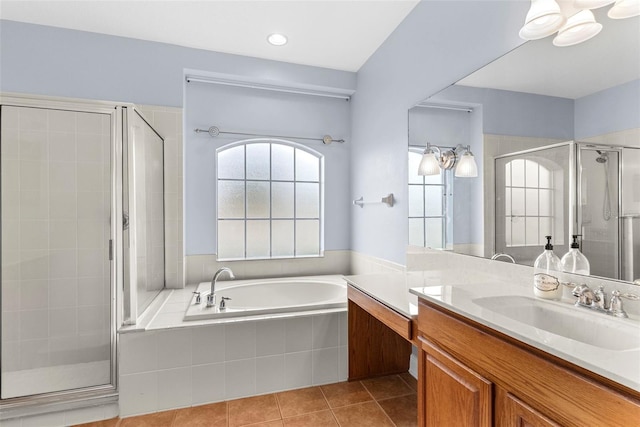 bathroom with vanity, independent shower and bath, and tile patterned floors