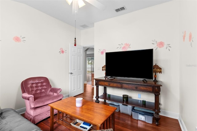 living room with hardwood / wood-style flooring and ceiling fan