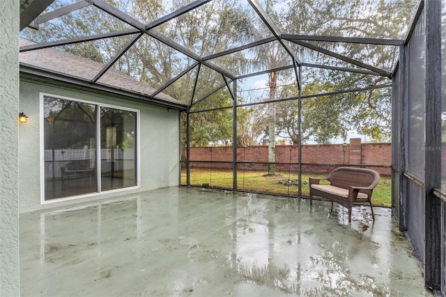 unfurnished sunroom featuring a patio area