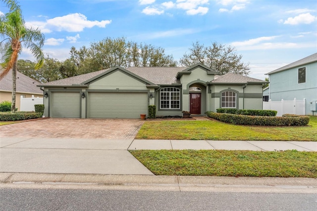 ranch-style house with a front lawn and a garage