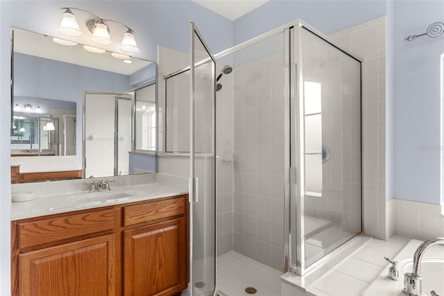 bathroom featuring vanity and walk in shower