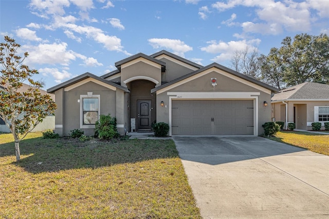 ranch-style home featuring a garage and a front yard