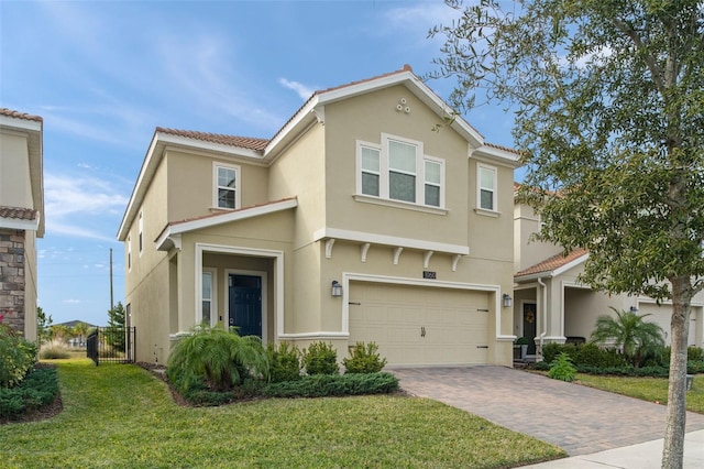 mediterranean / spanish-style home featuring a front lawn and a garage