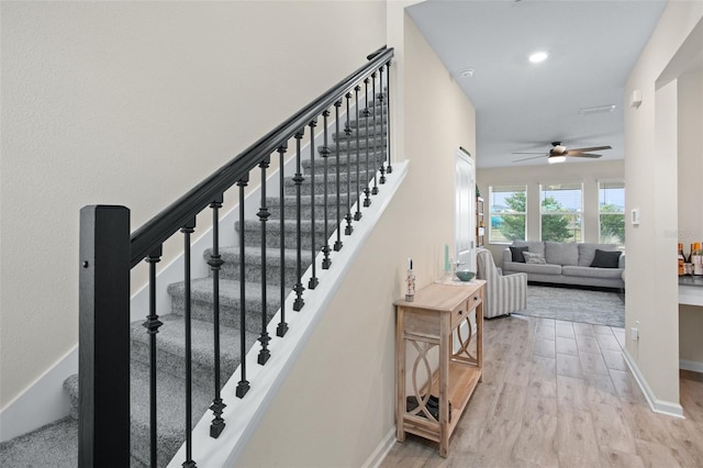 stairs with wood-type flooring