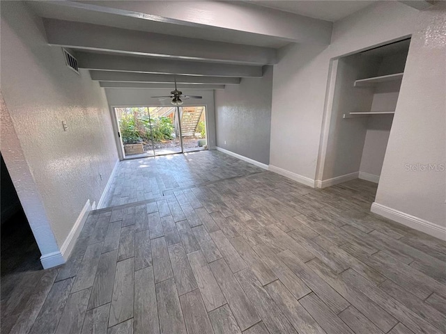 interior space featuring ceiling fan and beam ceiling