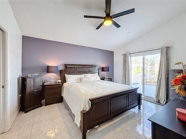 bedroom featuring ceiling fan, access to exterior, a textured ceiling, and lofted ceiling