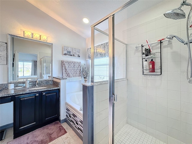 bathroom with tile patterned flooring, vanity, vaulted ceiling, and independent shower and bath