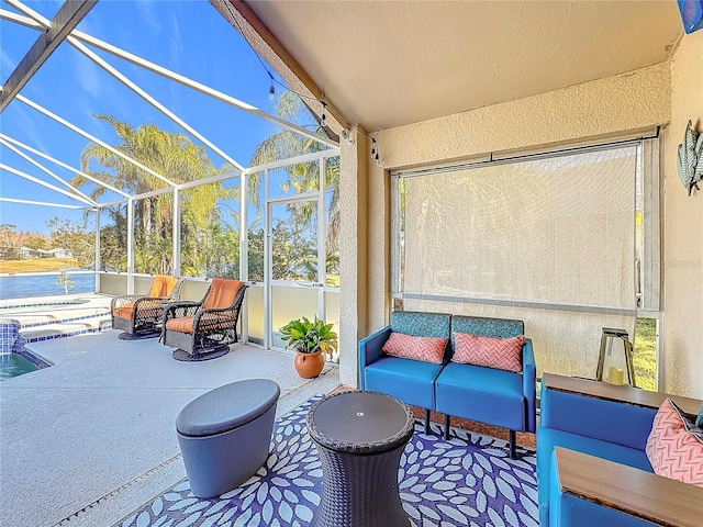 view of patio / terrace featuring outdoor lounge area, a lanai, and a water view