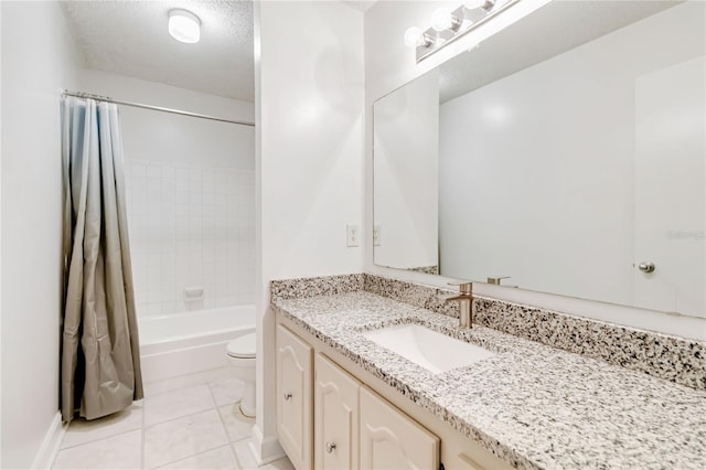 full bathroom featuring toilet, shower / bath combination with curtain, tile patterned floors, a textured ceiling, and vanity