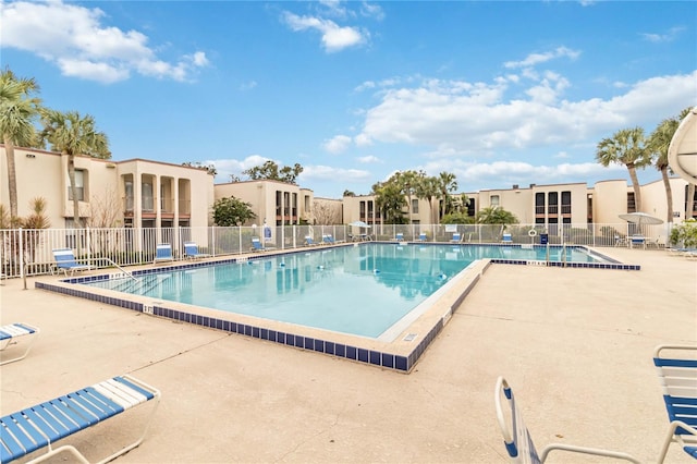 view of swimming pool with a patio area