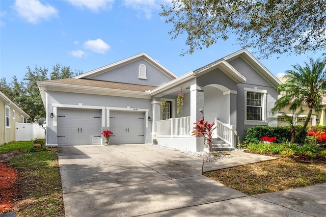 view of front of home with a porch and a garage