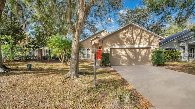 view of front facade featuring a front lawn and a garage