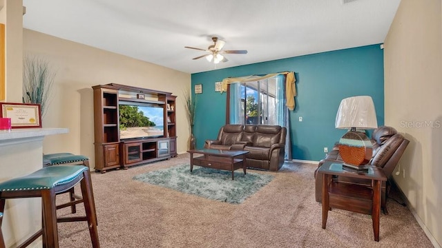 living room featuring ceiling fan and carpet floors