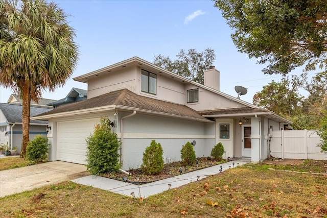 view of front facade with a garage and a front lawn