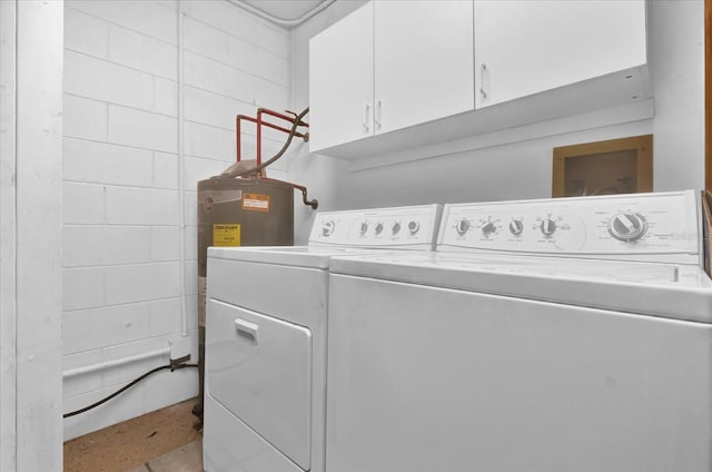 laundry room with cabinets and washer and dryer