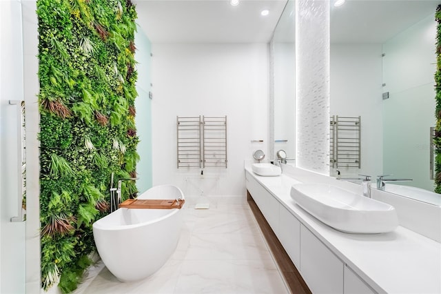 bathroom featuring a bath and vanity