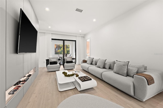 living room with light hardwood / wood-style flooring