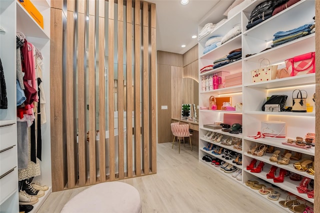 spacious closet featuring light hardwood / wood-style flooring