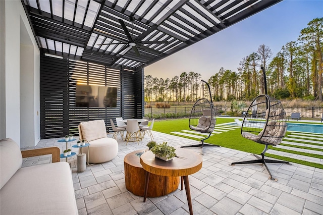 patio terrace at dusk with a yard and a pergola