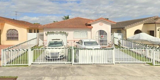 view of front of property with a garage