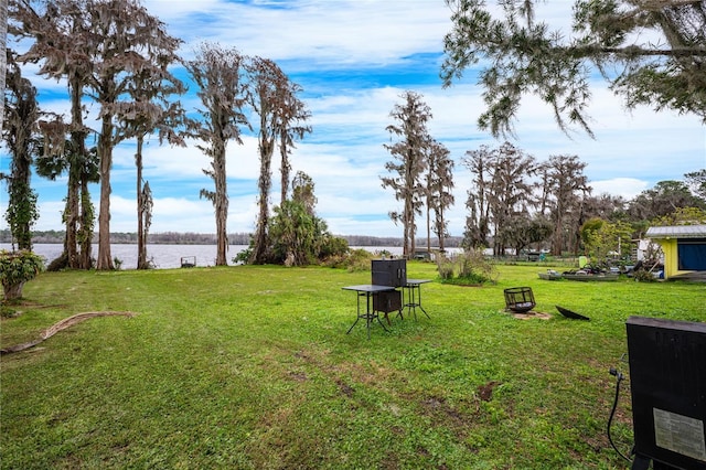 view of yard with a water view