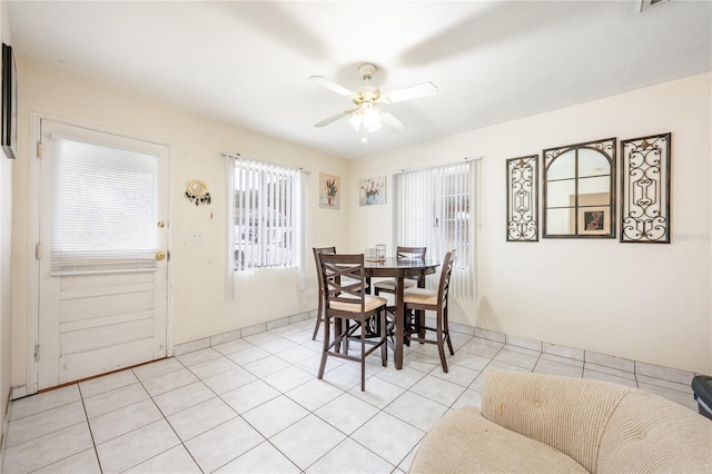 dining room featuring light tile patterned floors and ceiling fan