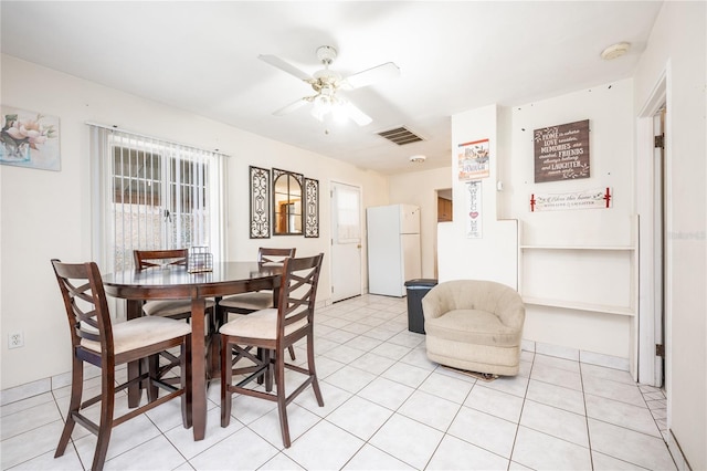 dining room featuring ceiling fan and light tile patterned floors