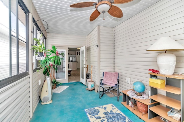 sunroom / solarium with ceiling fan